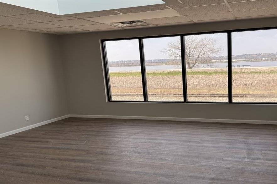 Office with windows showing Mississippi River and rail line